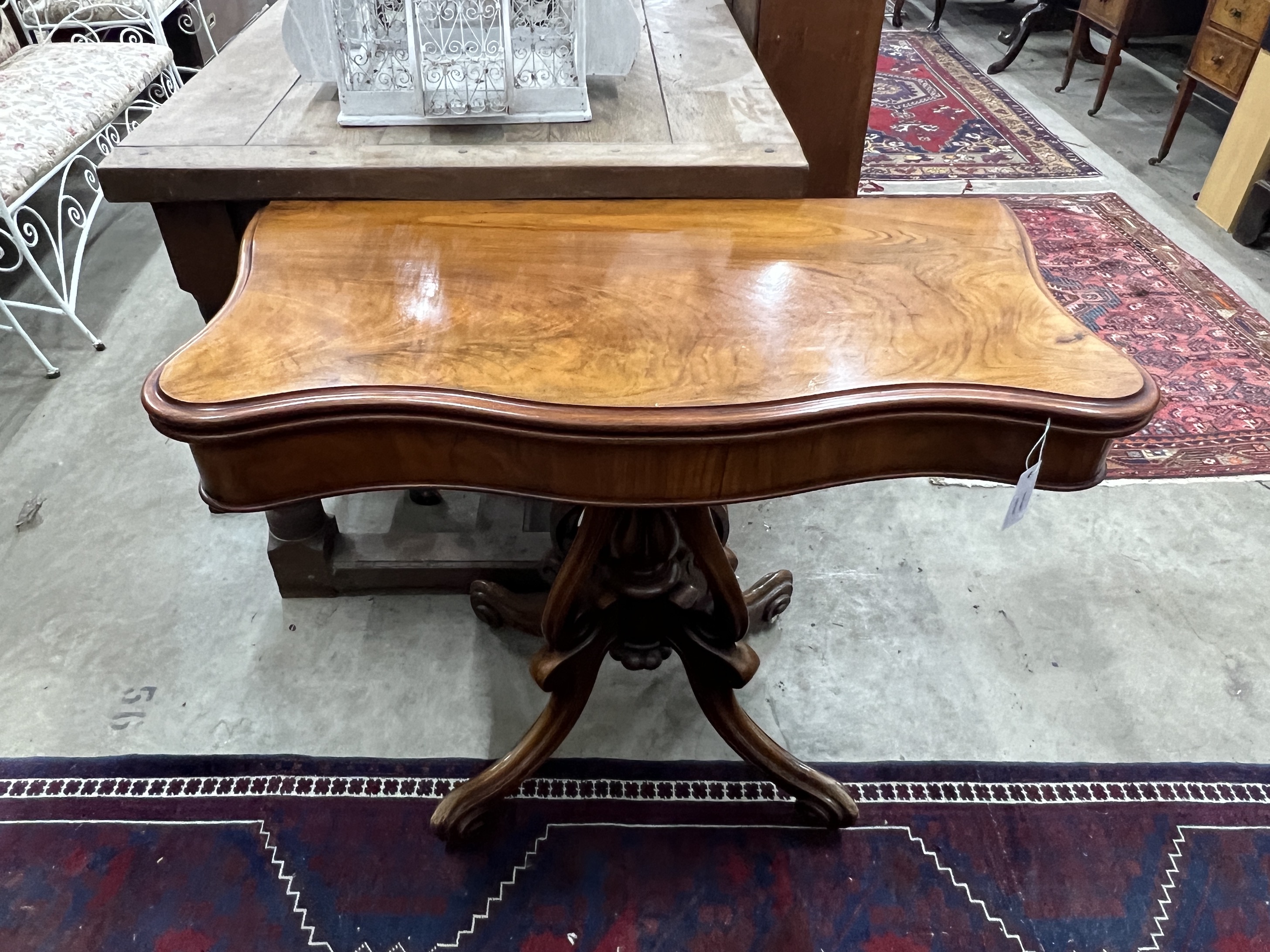 A Victorian mahogany serpentine card table, width 90cm, depth 45cm, height 73cm
